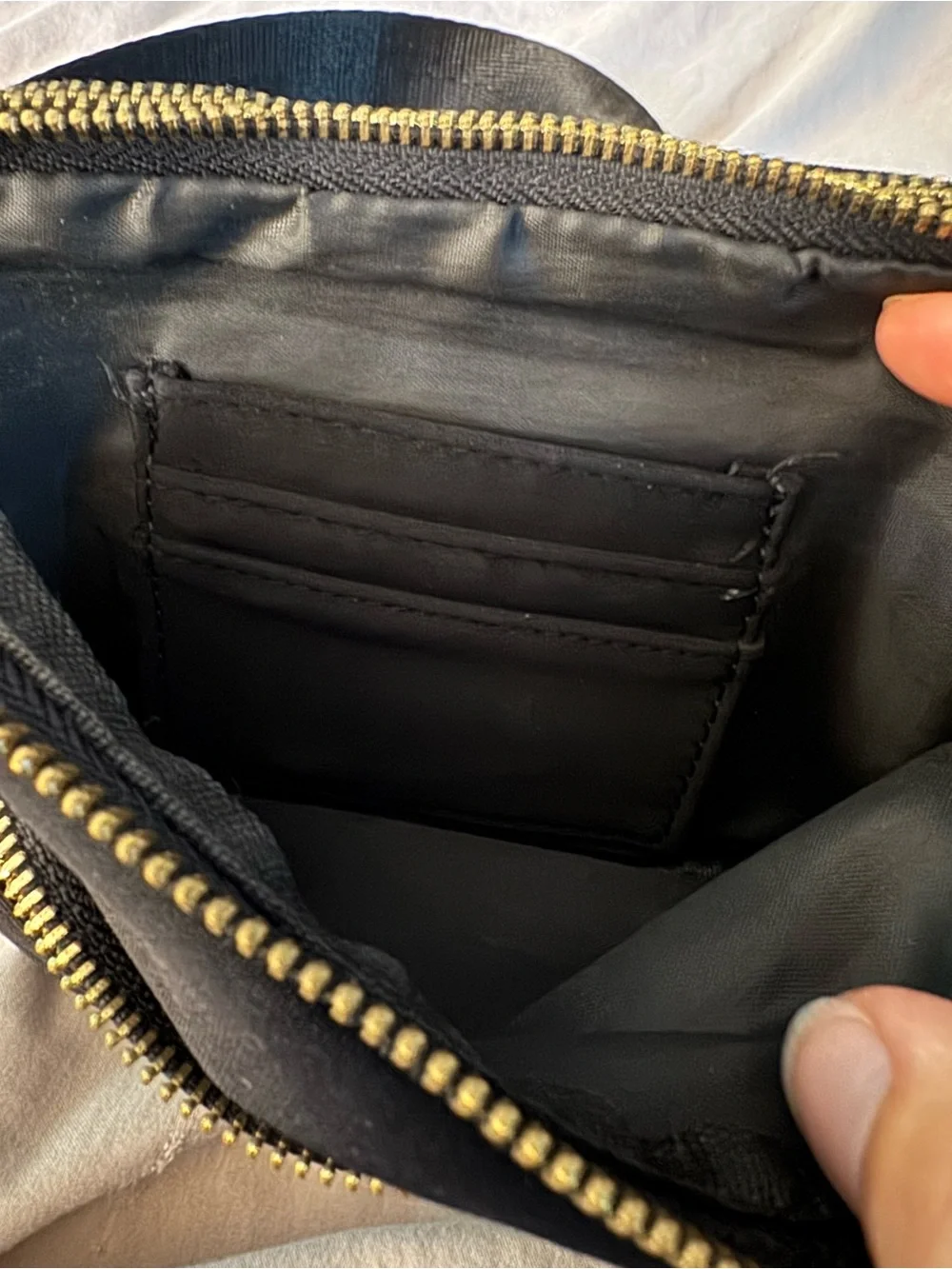 Black Crossbody Bag with Gold Zipper Pull by Zorfin